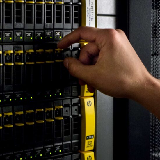 Industrial rack of hard drives being maintained