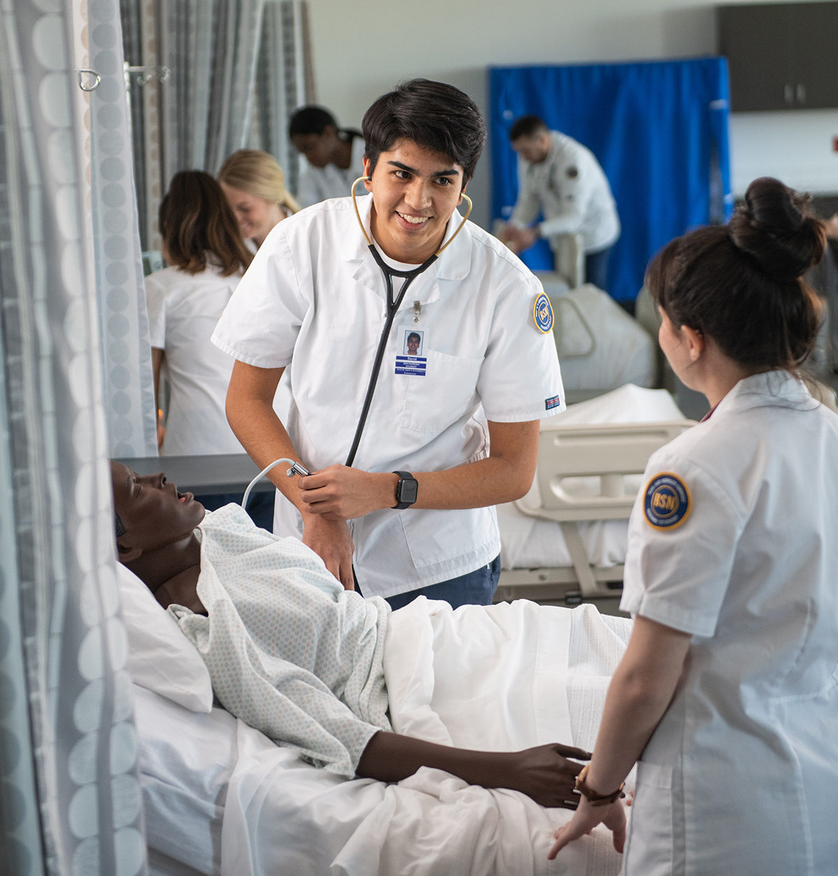 Two nursing students in the simulation lab.