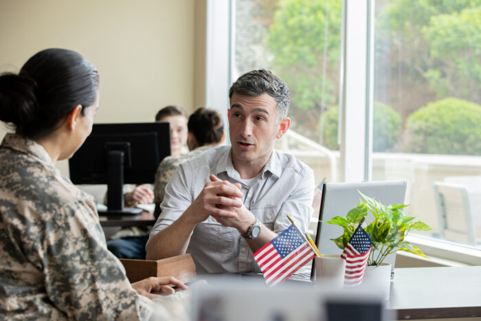 Financial planner meeting with a military solider.