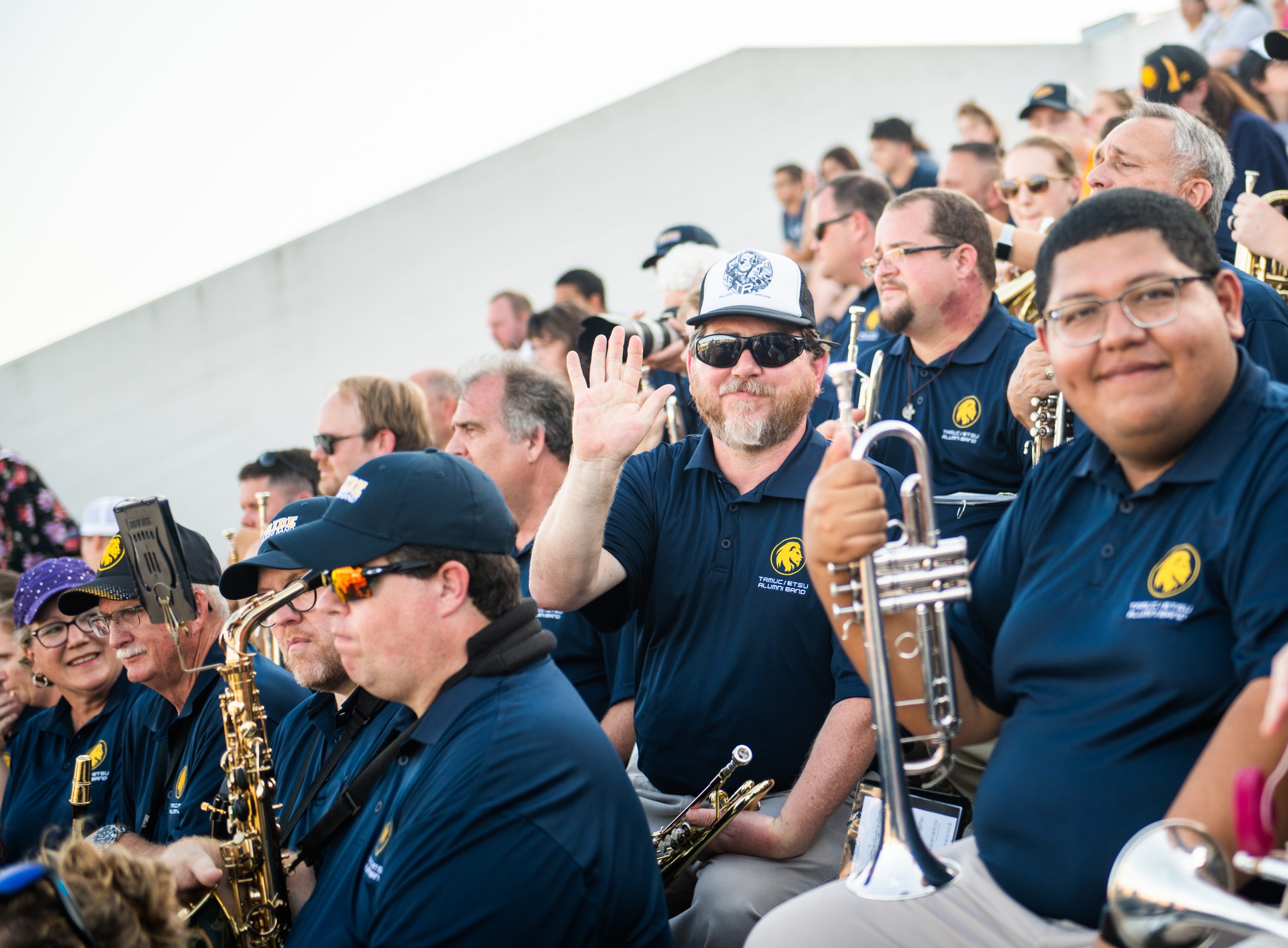 band member waving to the camera