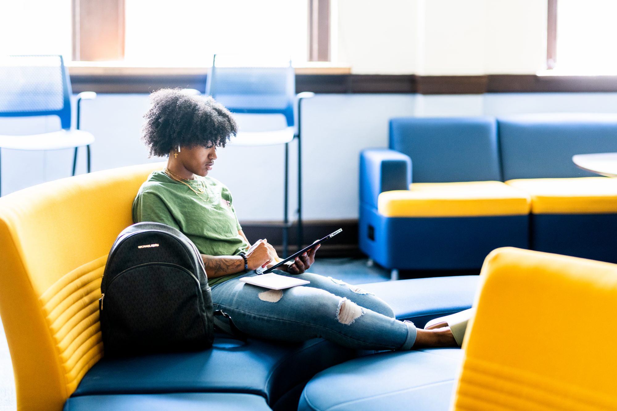 A male student on a study bench, studying.