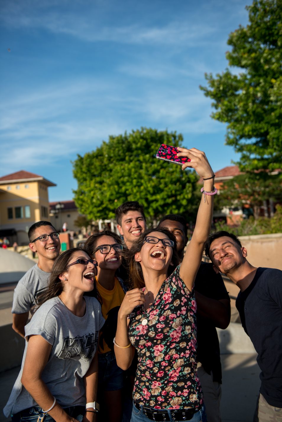 A group of students smiling while taking a selfie.