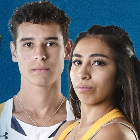 Two cross country athletes with arms crossed, looking at camera