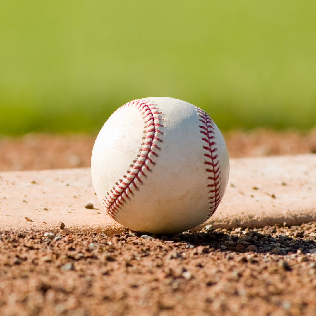A close up of a baseball on the field.