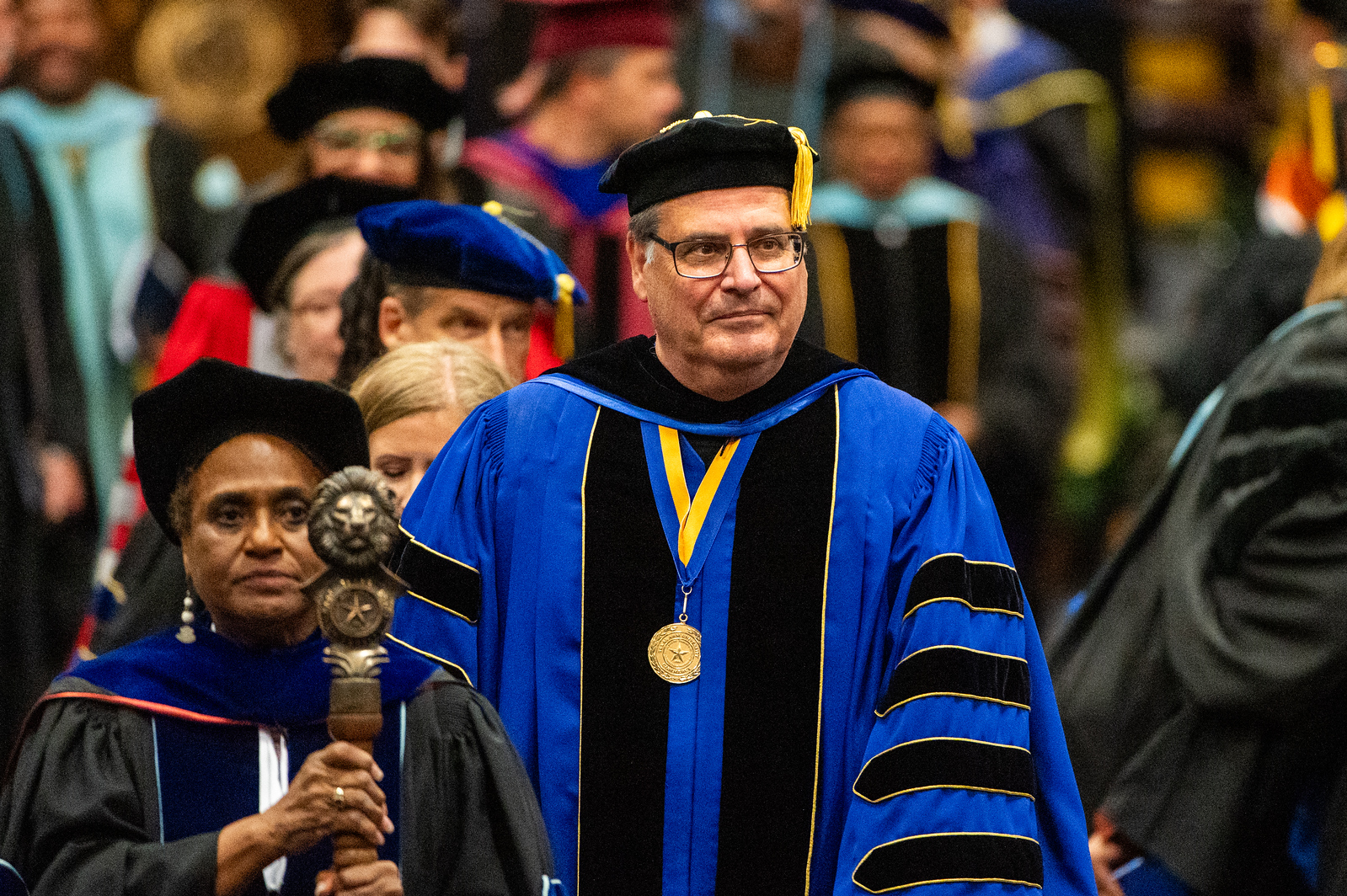 President Rudin in graduation regalia proceeding into the ceremony