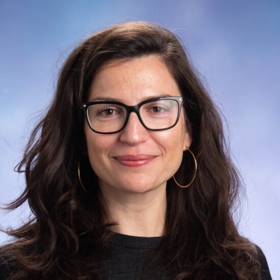 A headshot photo of Assistant Professor Eralda Lameborshi wearing a dark shirt.