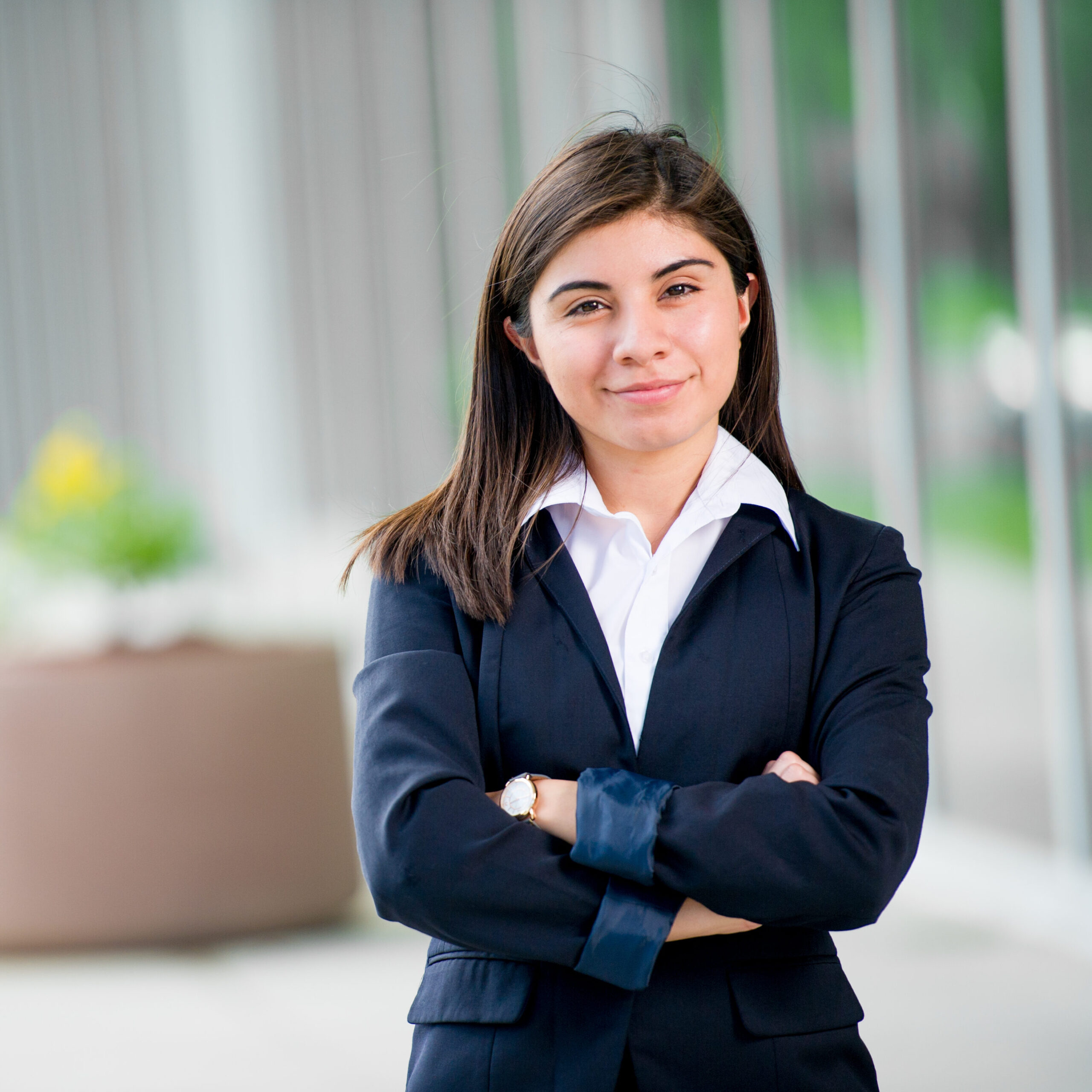 A female in a business suit posing.