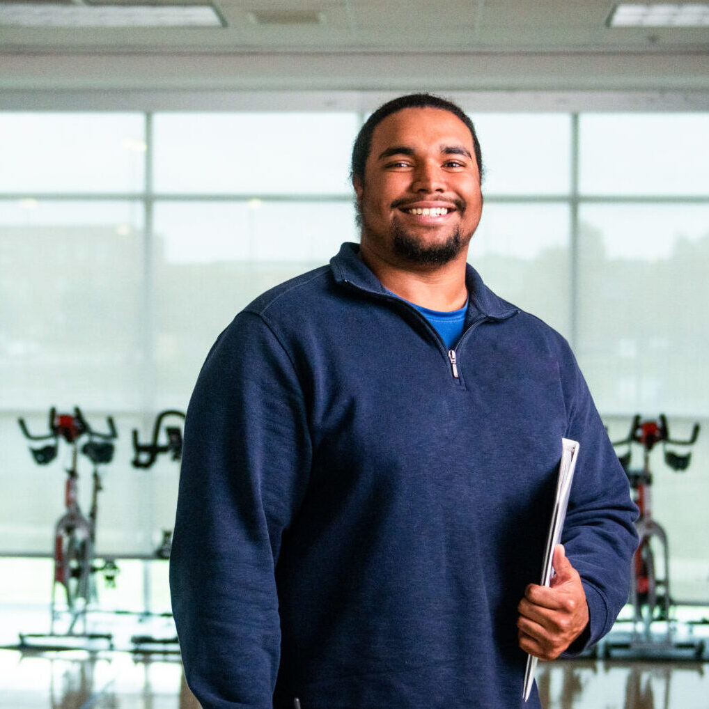 ETAMU Sport and Recreation Management student smiling at the camera.