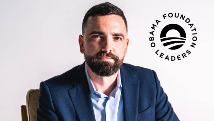 A headshot photo of a person with the logo of the Obama Foundation in the top right corner.