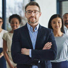 Team of smart and successful business people, leader or manager looking happy, satisfied or confident with their job, career and business. Face portrait of smart or ambitious corporate men and women