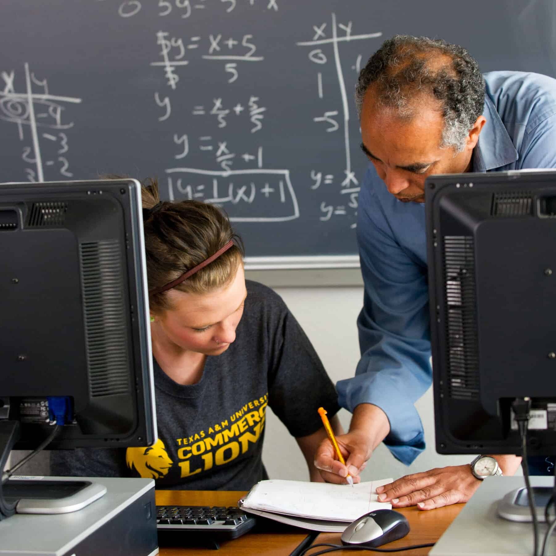 Math professor helping student