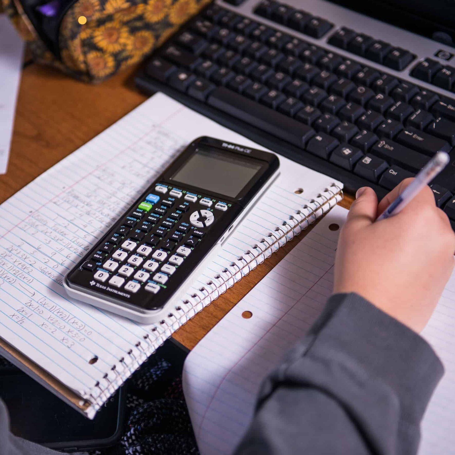 Close-up of student working on math homework