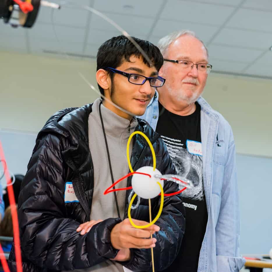 Student carrying science project.