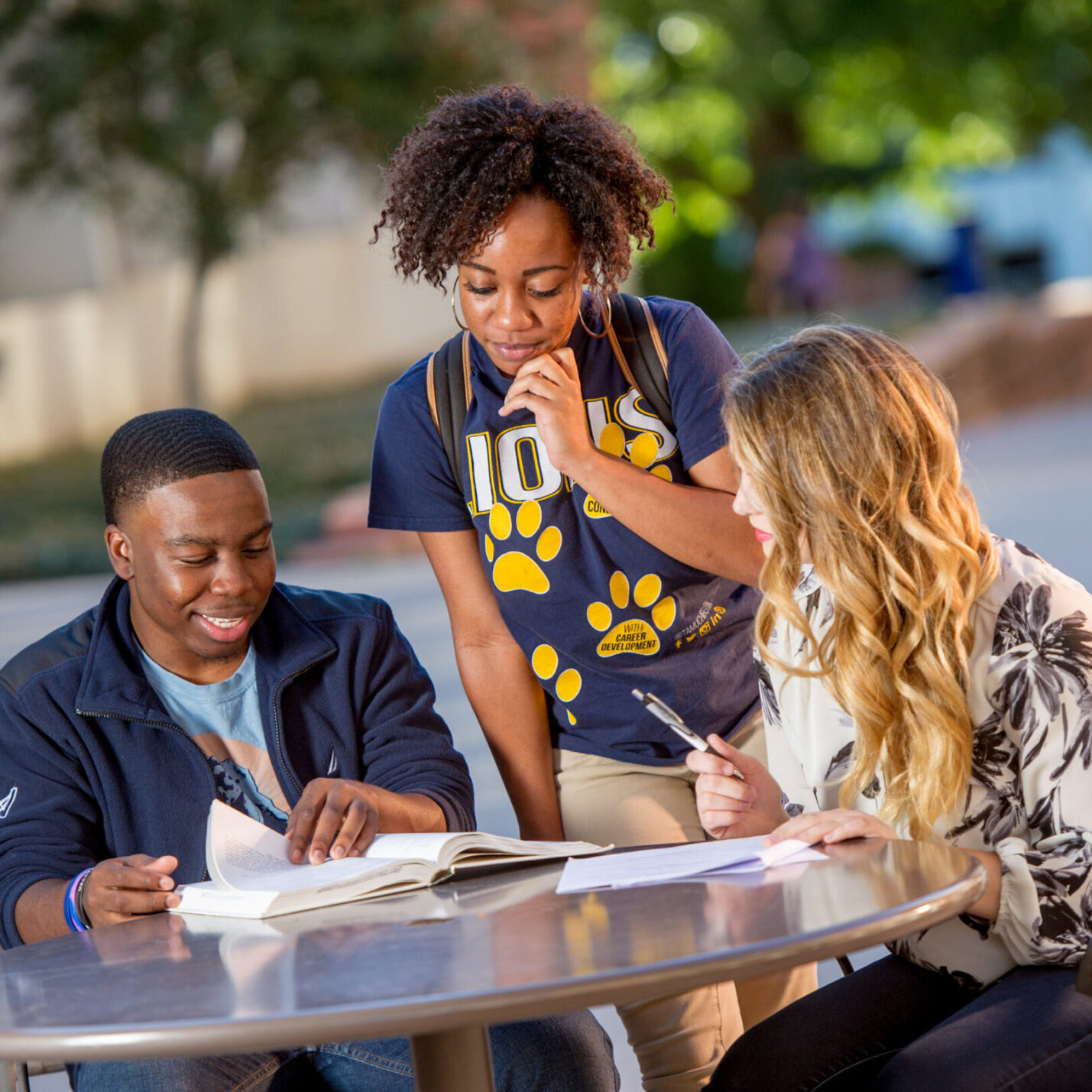 Group of students studying at a table.