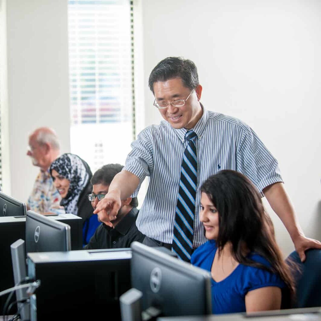 Instructor helping a student.