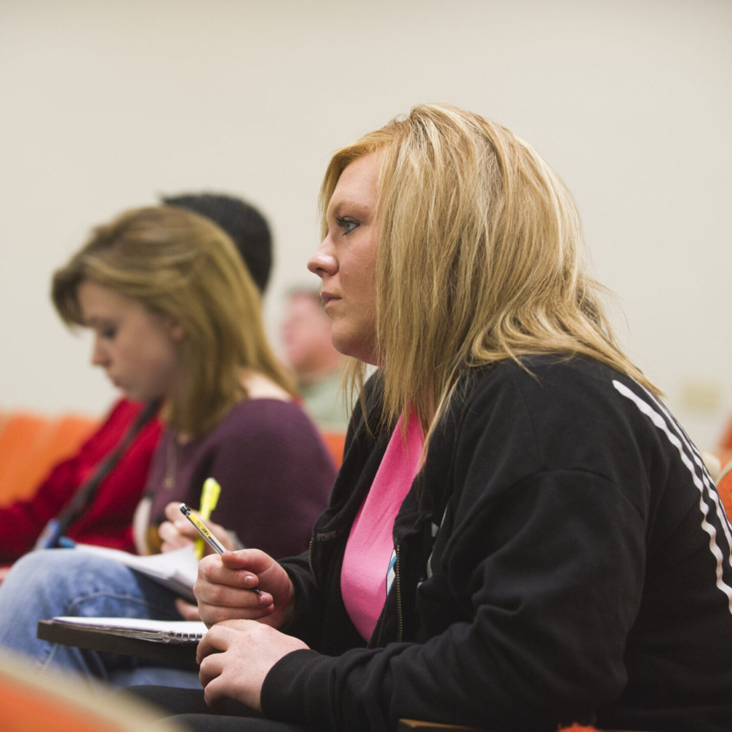 Women taking notes in an english class.