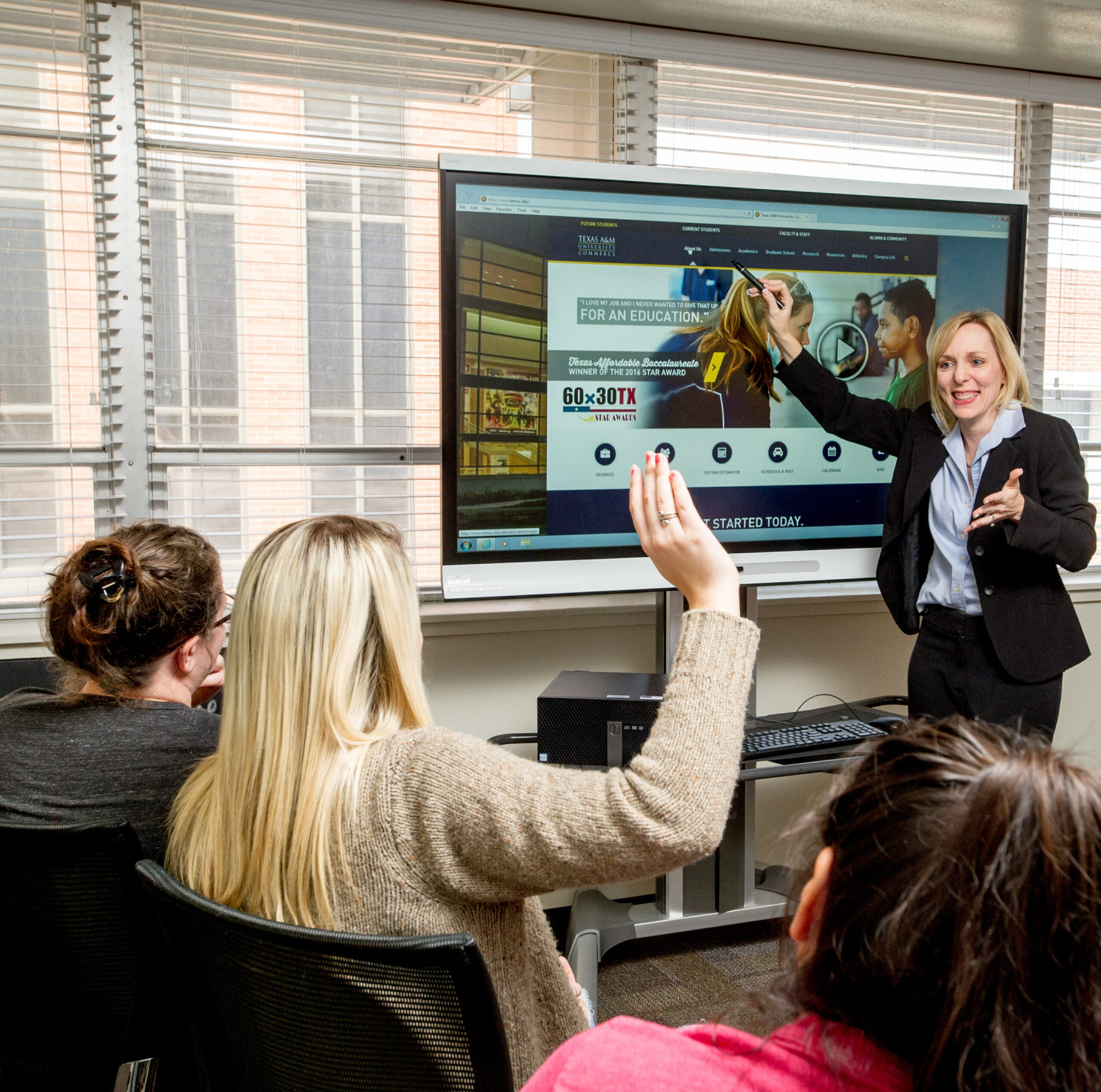 Dr. Jones in her assistive technology room teaching students.