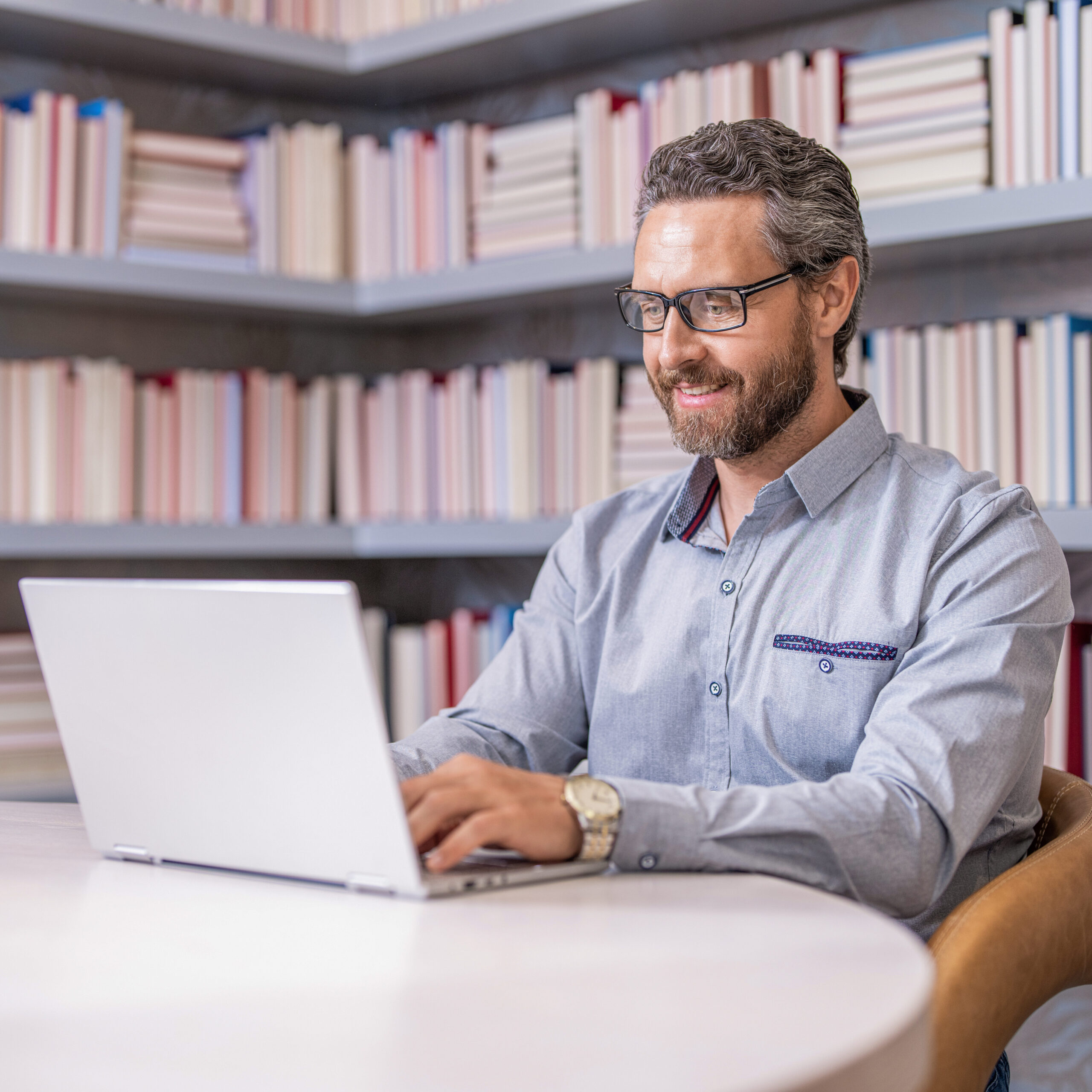 A male working on a laptop