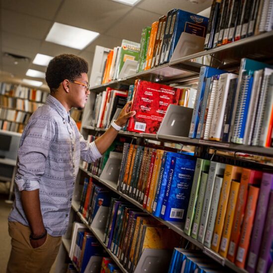 student in library