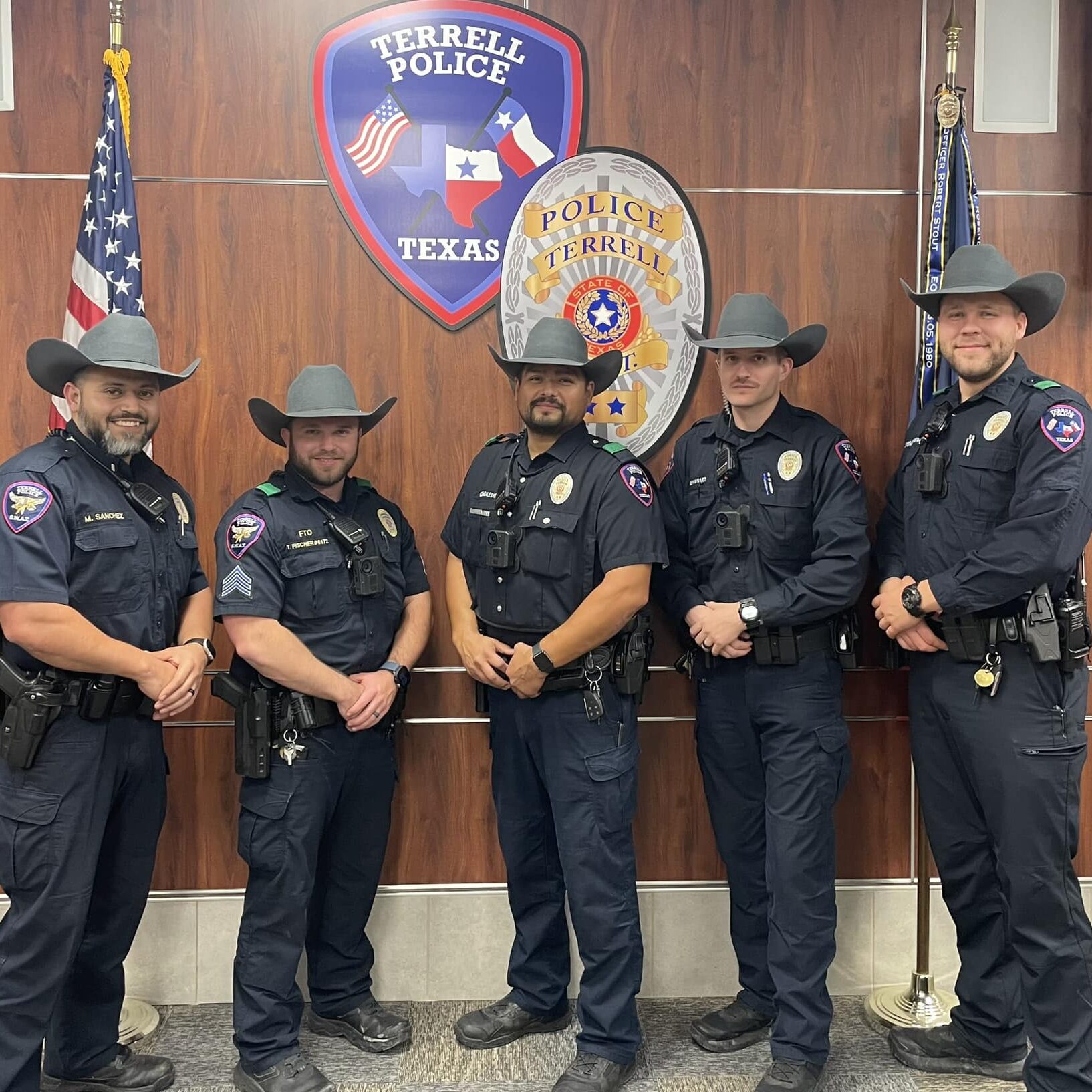 Five male officers representing the Terrell Police Department