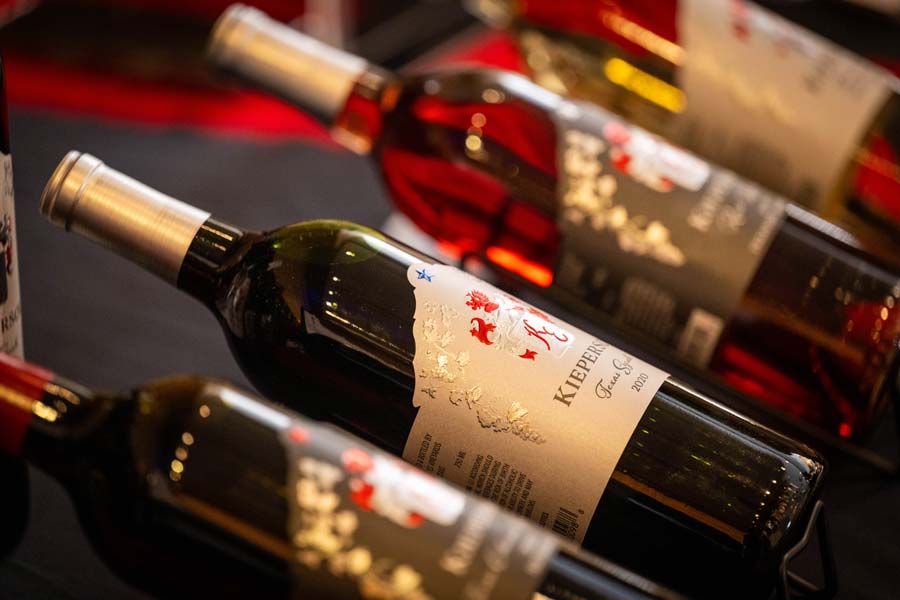 Four bottles of wine on display.