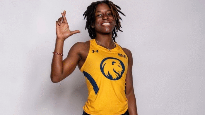 A headshot photo of a person in a track and field uniform.