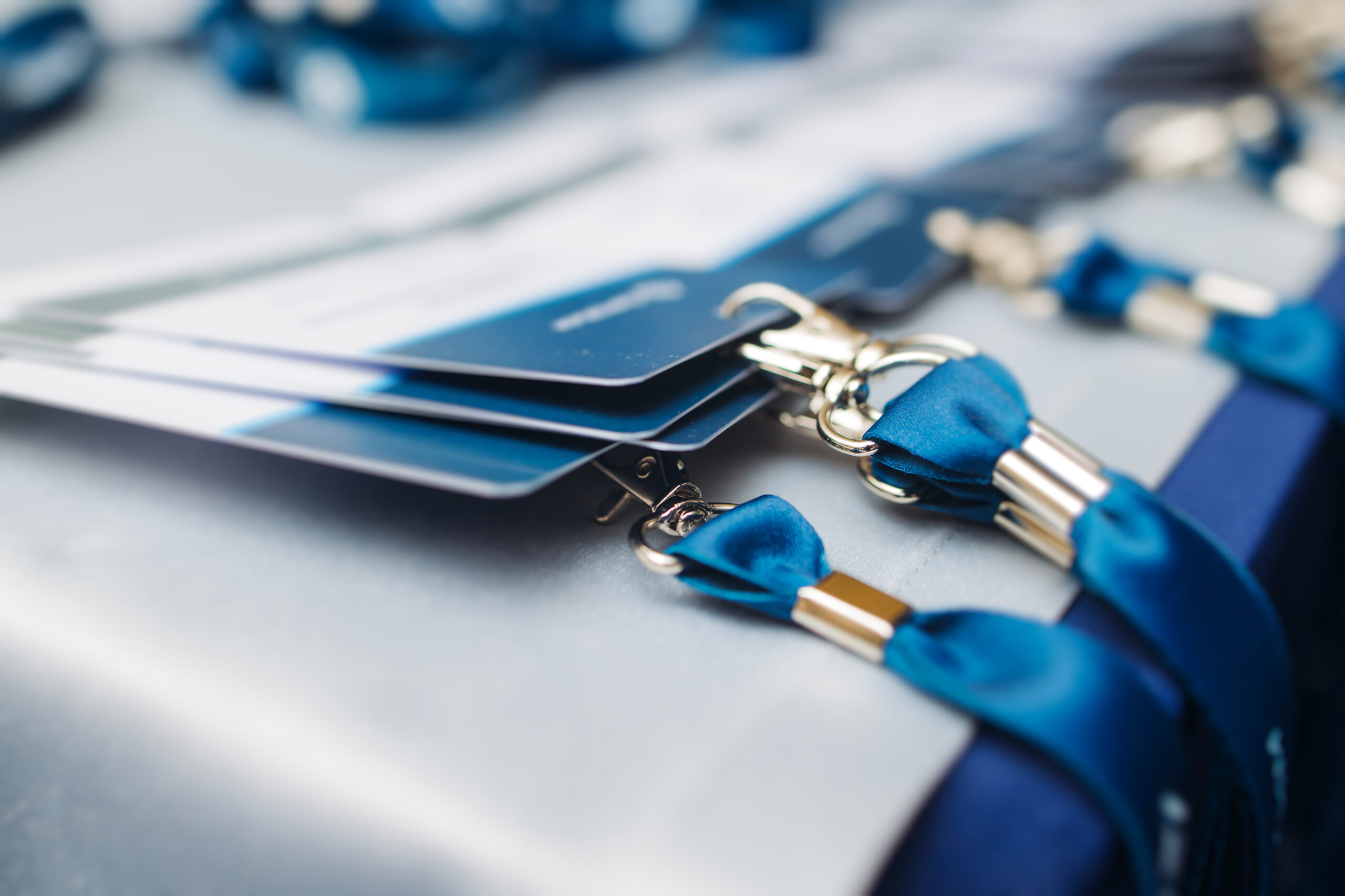 Closeup of blue and white lanyards on a table