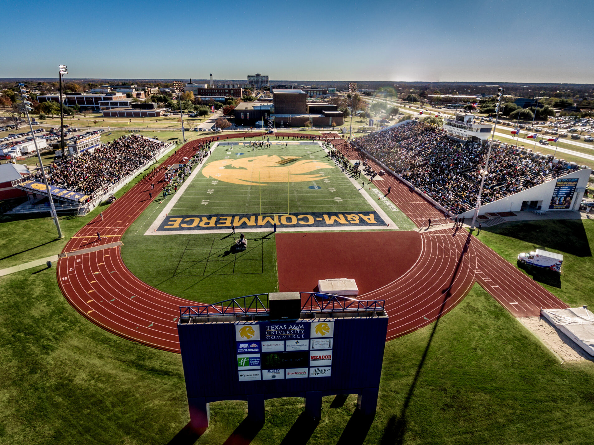 An aerial shot of a football stadium packed with fans.