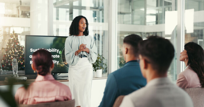 A female professor lecturing a class.