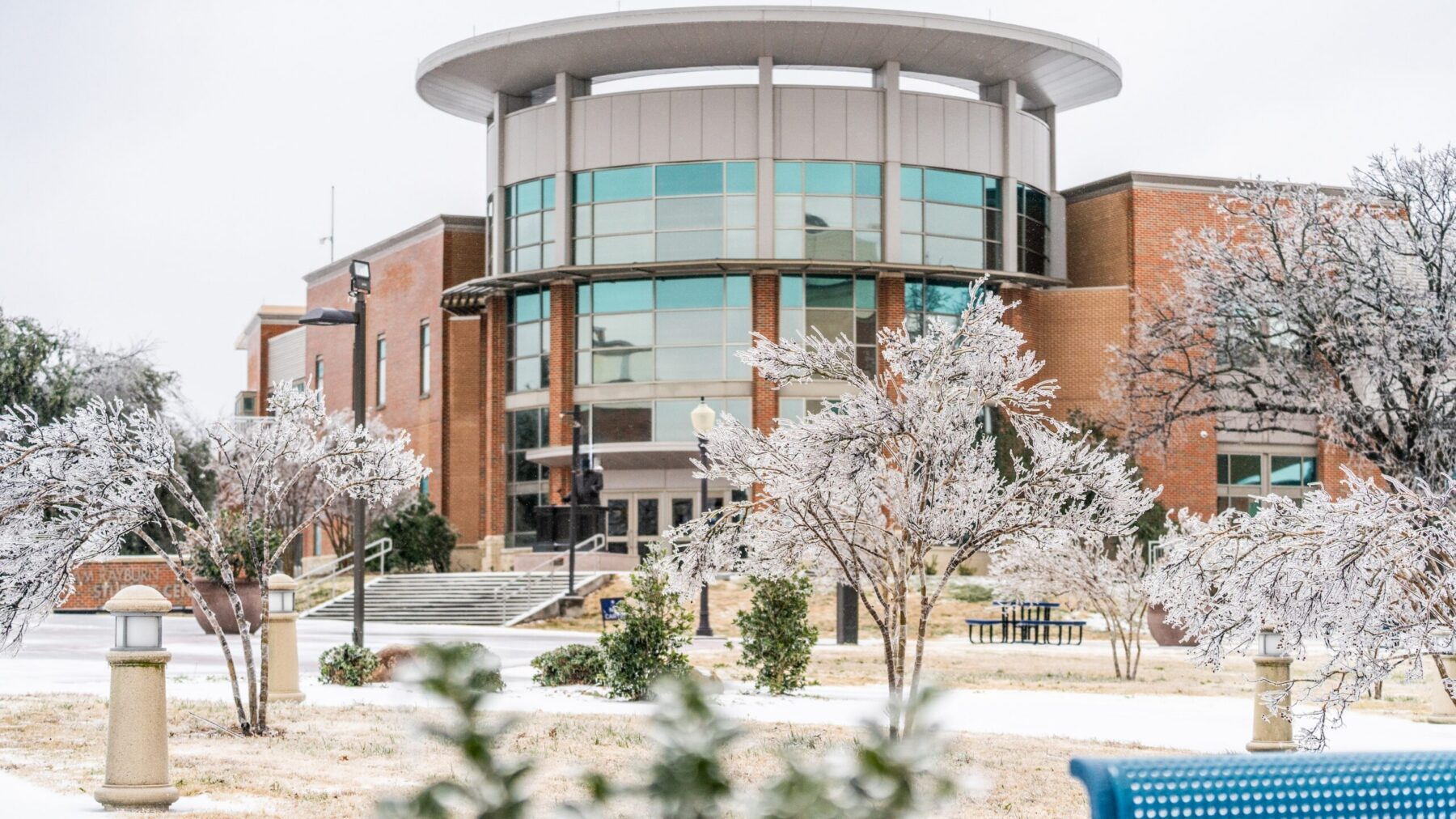 A building on a college campus in a snowy, winter setting.