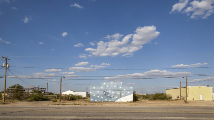 A photograph of a building in a rural town