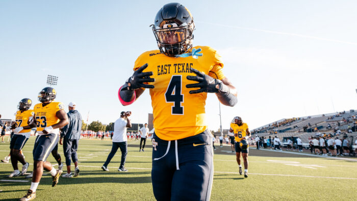 A football player in full uniform before a game.