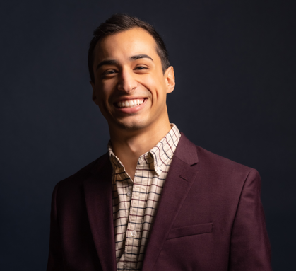 Edward James Monroy IV smiling