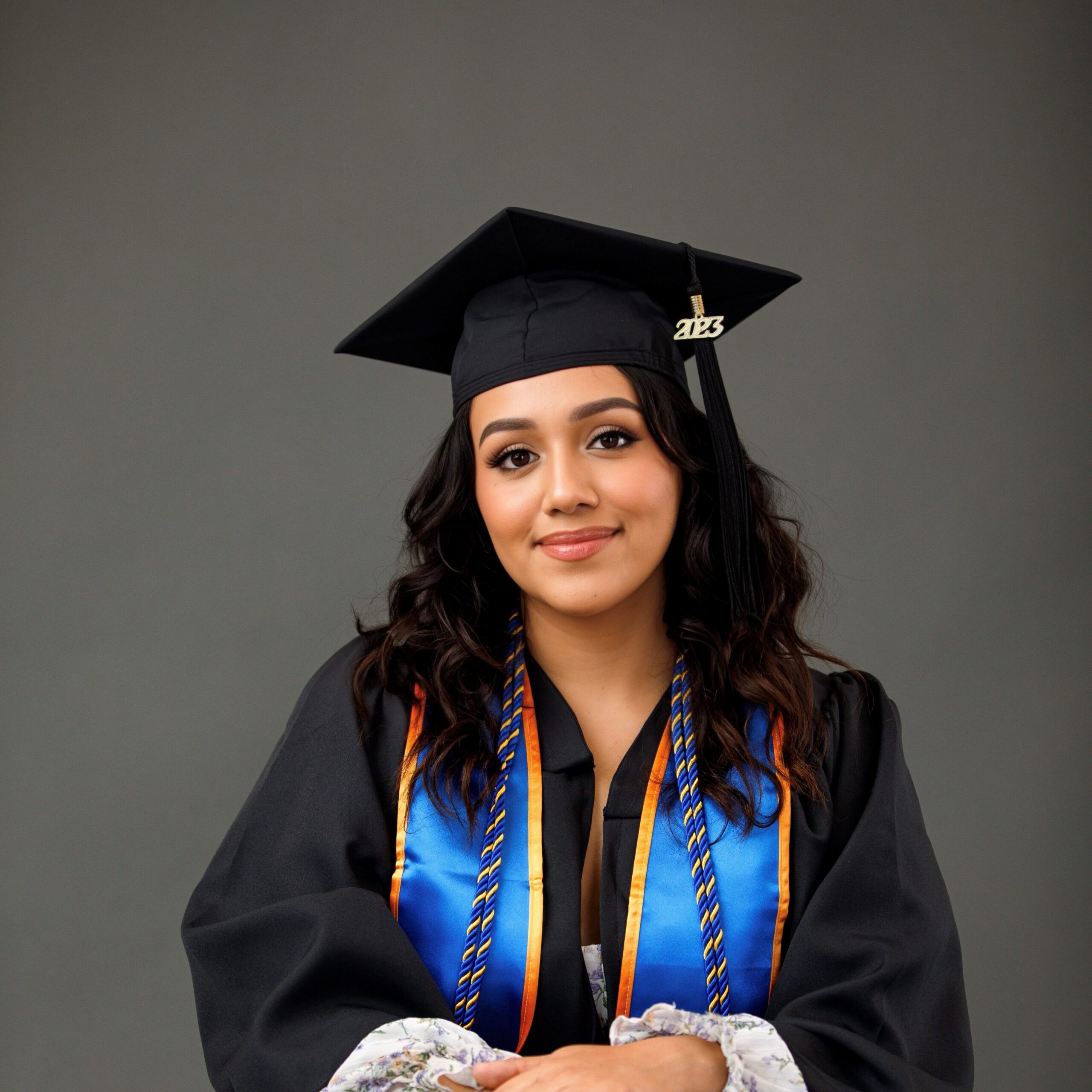 Kate Quintanar smiling in cap and gown