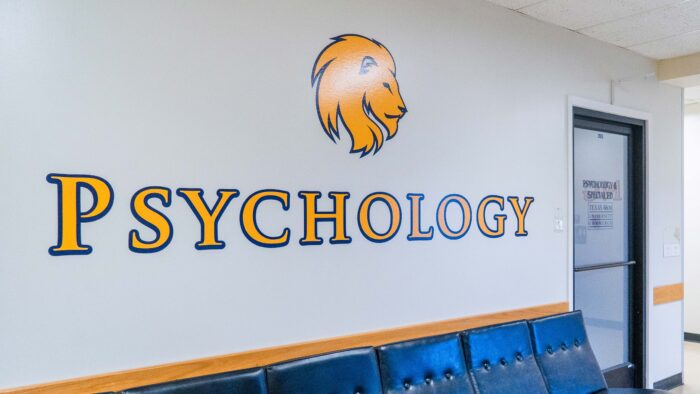 A hallway with "Psychology" stenciled on the wall.
