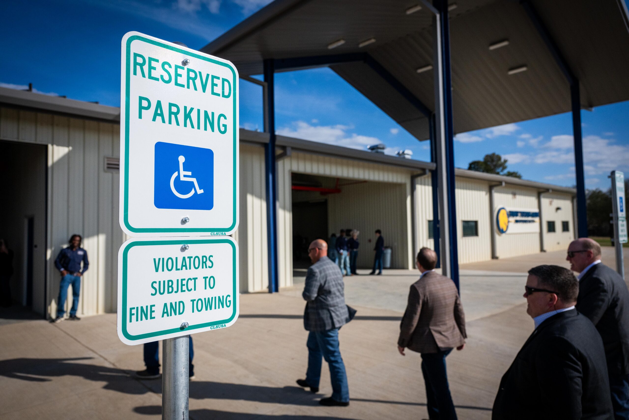 A Reserved Parking sign denoting an accessible parking space on campus.