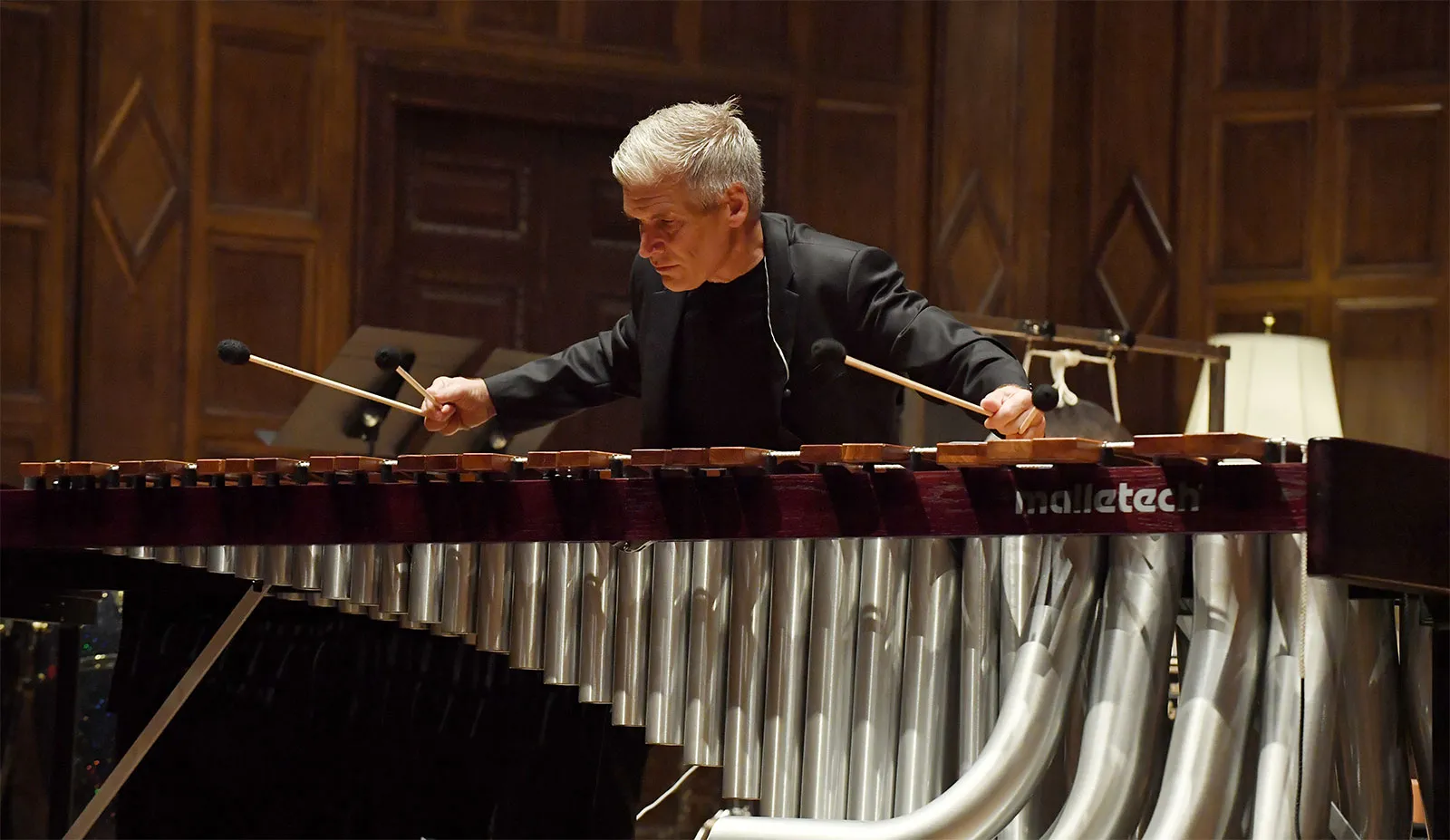 A man plays a percussion instrument.
