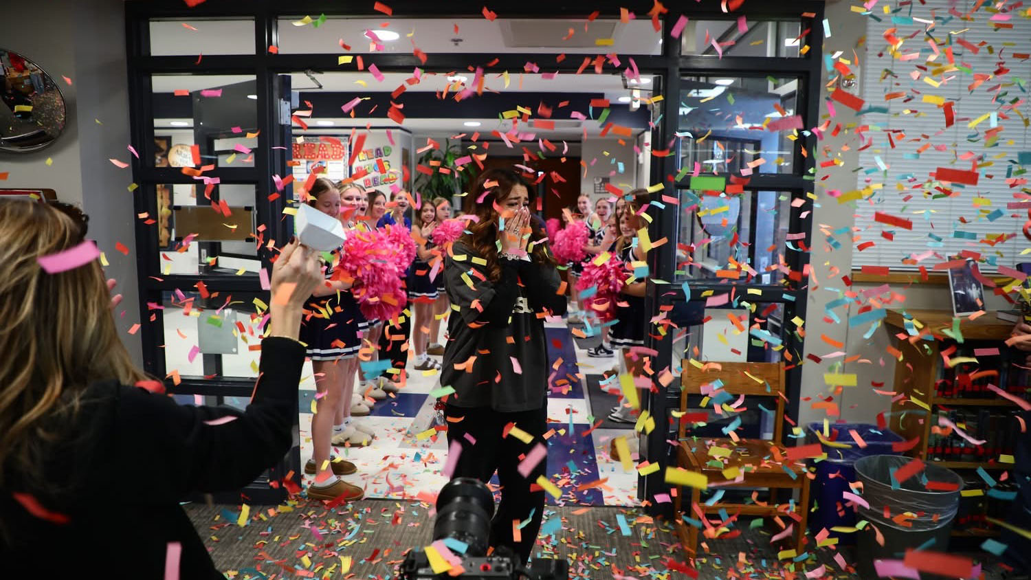 Elisabeth being surprised by a confetti celebration