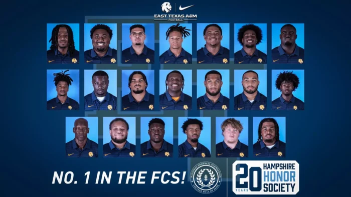 Headshots of 20 students are arranged in three rows. Each individual is looking at the camera while wearing a navy shirt with a Nike swoosh on one side and a lion head logo on the other side.