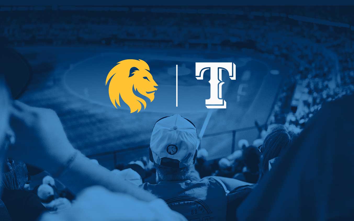 Lion logo and Texas Rangers logo in front of fans watching a baseball game