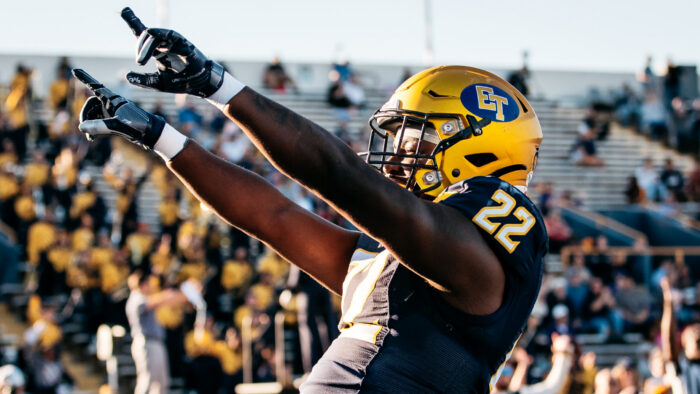 A football player celebrating after a touchdown