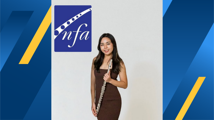 A person holding a flute in front of a white background.