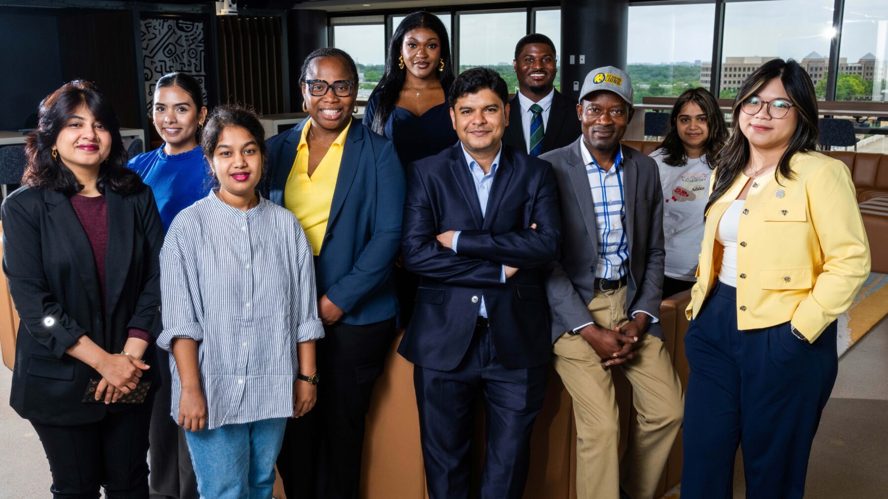 Several people standing together smiling at the camera.