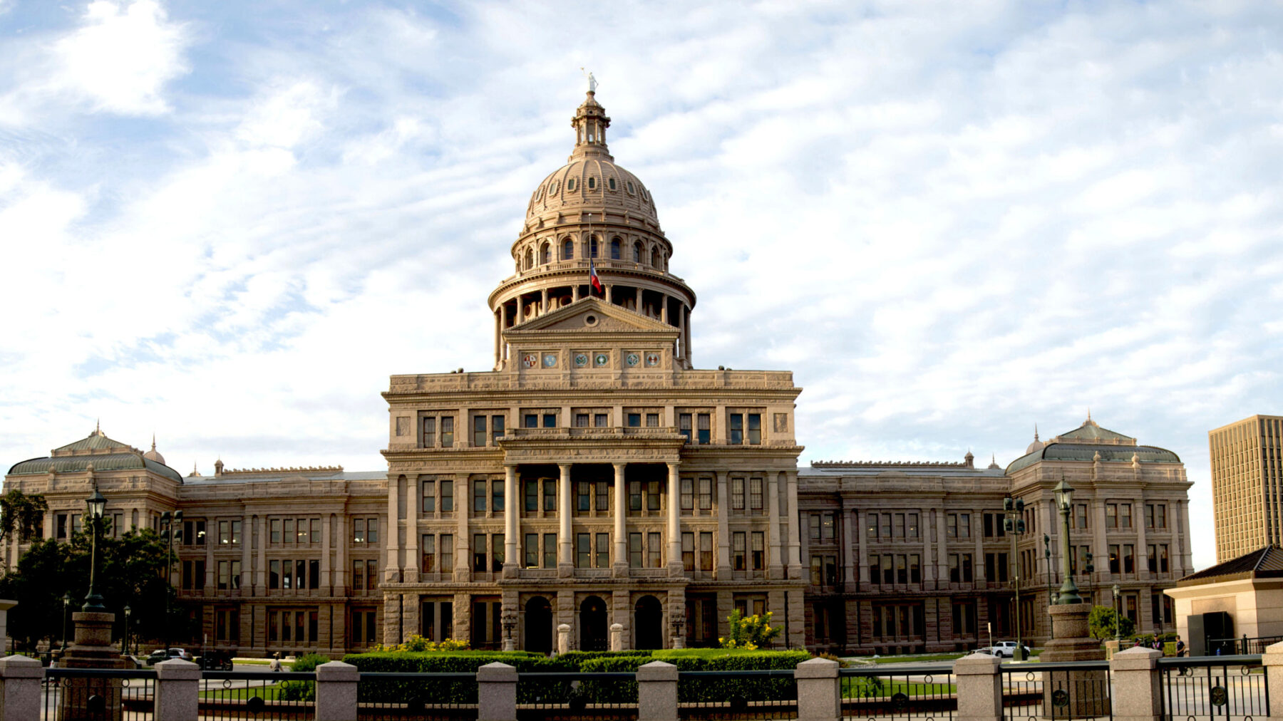 A photo of a large capitol building with a prominent dome.