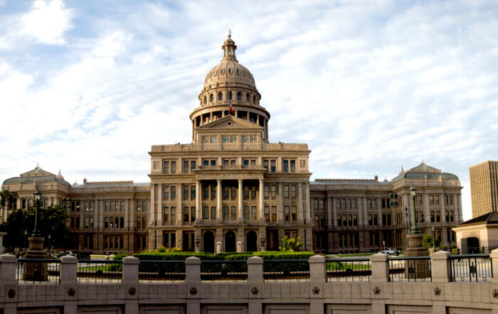 A photo of a large capitol building with a prominent dome.