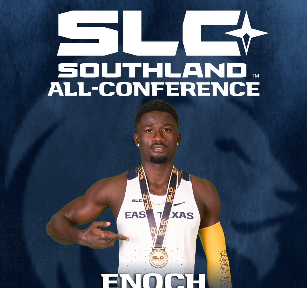 A track and field runner posing with a gold medal