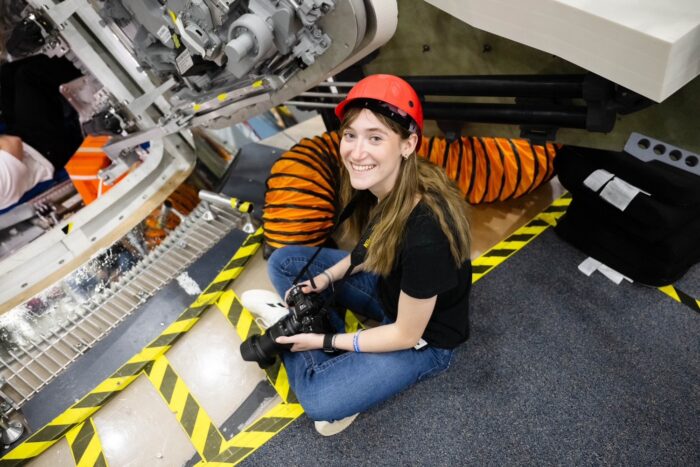 A photographer at the Johnson Space Center photographing a training excersize.