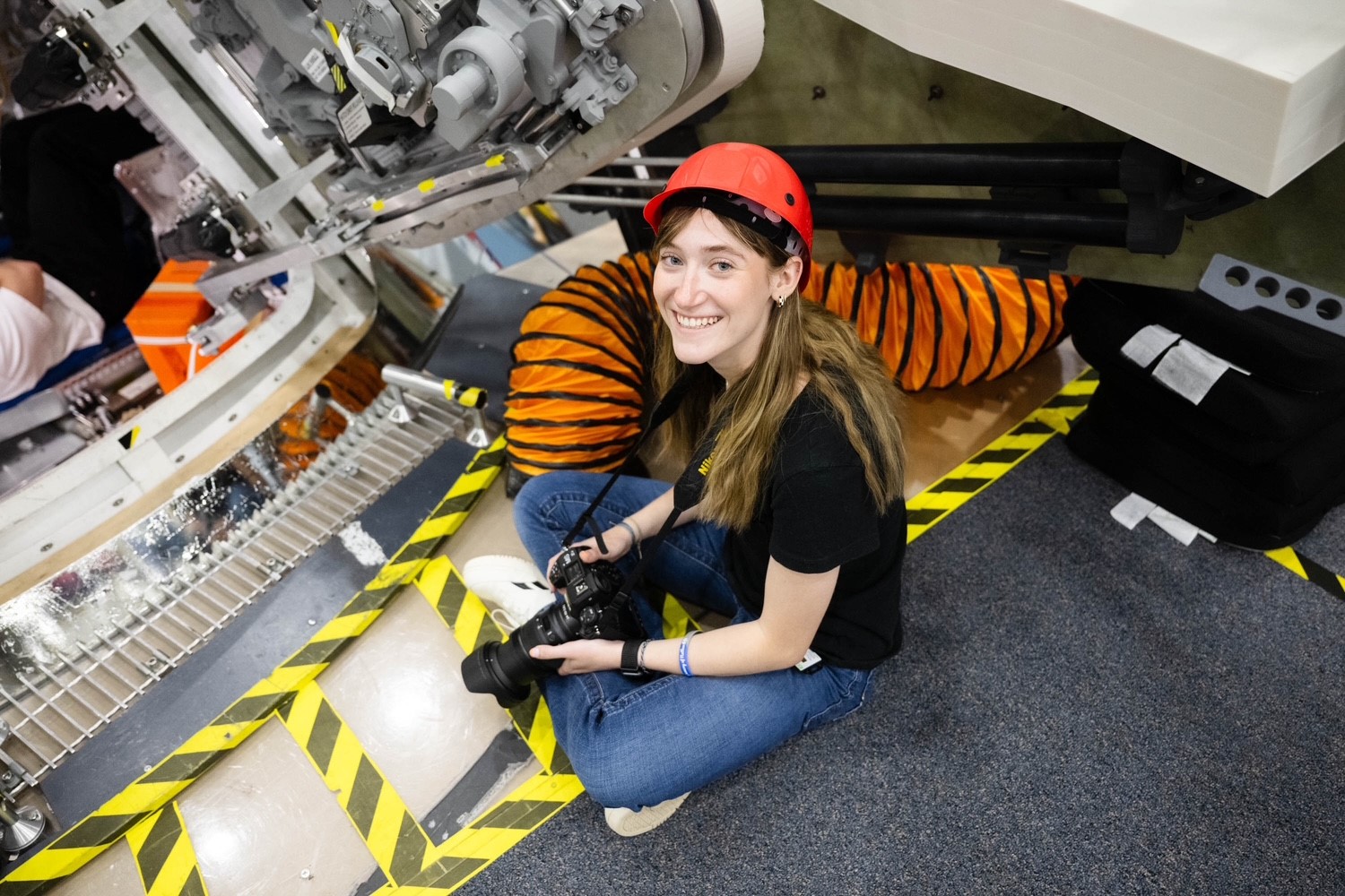 A photographer at the Johnson Space Center photographing a training excersize.