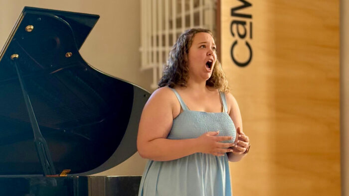 A soloist singing a song during a recital