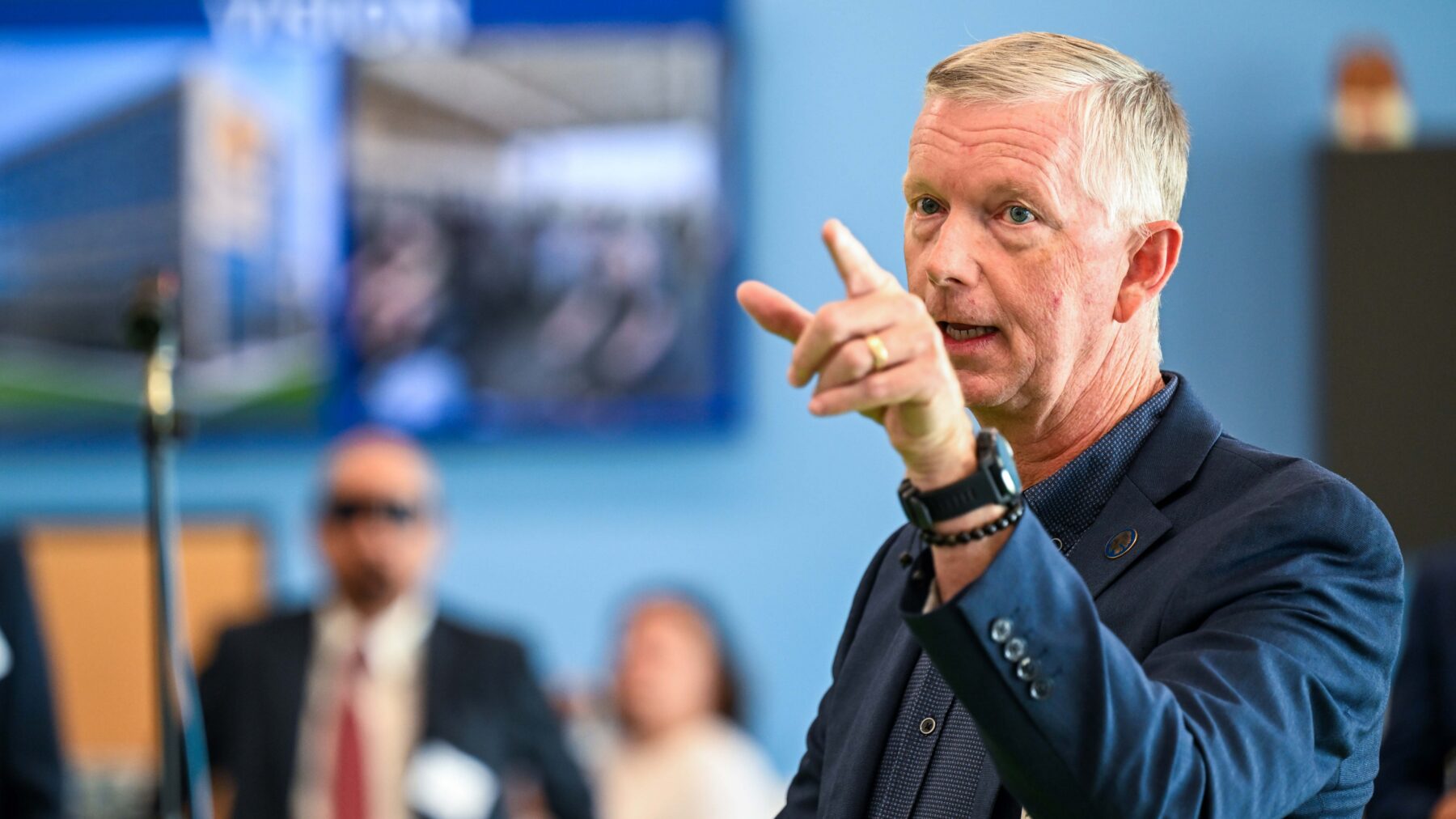 A man talking and pointing.